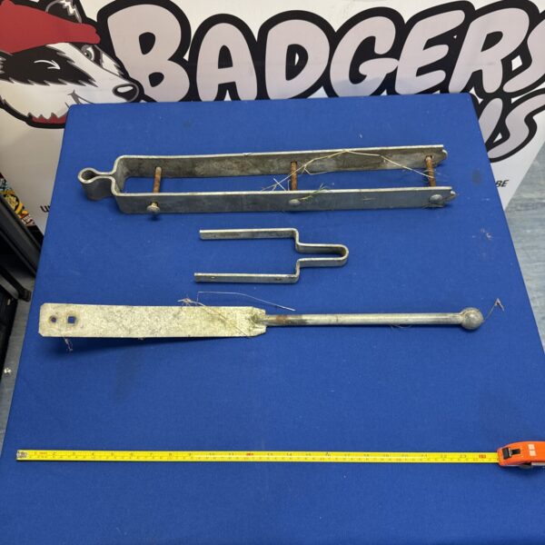 Vintage metal gate latch set for farm or garden use.