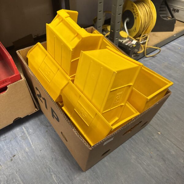 Quantity of large yellow RS storage trays for industrial use.