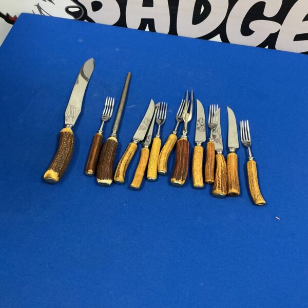 Vintage horn handle cutlery set with silver plated blades.