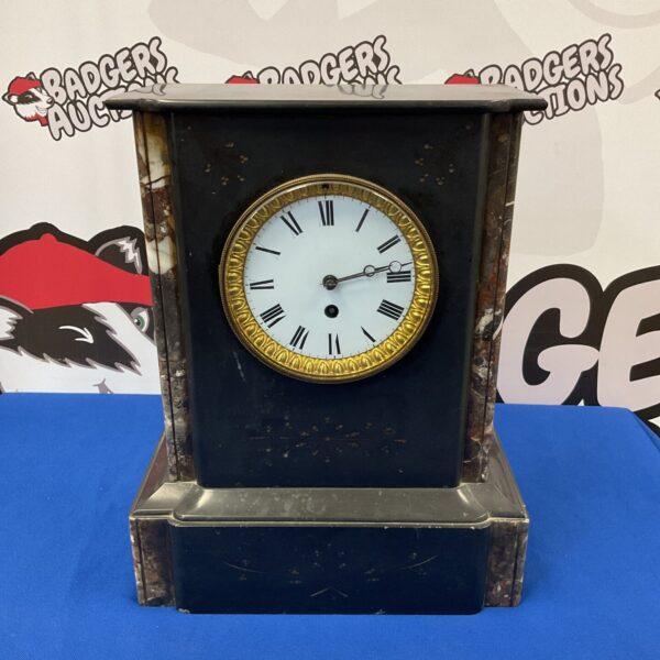 Antique Victorian slate mantle clock with marble details.