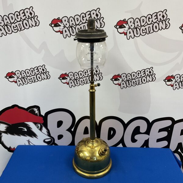 Vintage brass Tilley lamp with clear glass globe.