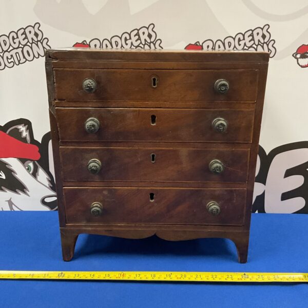 Vintage watchmakers drawers with lion head knobs for collectors.