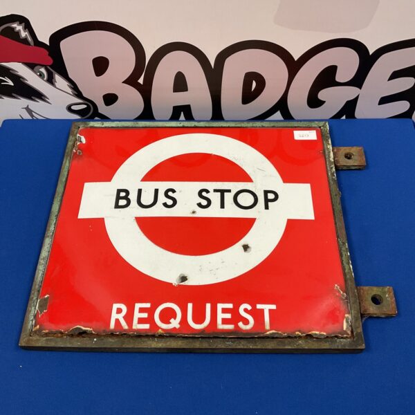 Vintage London bus stop sign with red and white enamel.