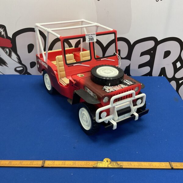 Front view of a large One Direction themed plastic jeep.