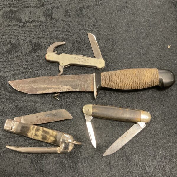 Vintage Sheffield pocket knife lot with multiple blades and tools.