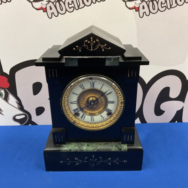 Antique American slate mantle clock with porcelain dial and marble base.