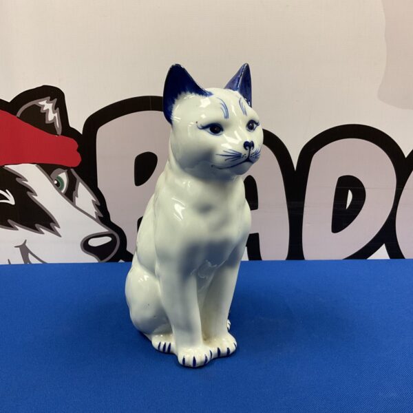 Vintage blue and white porcelain cat figurine for collectors.