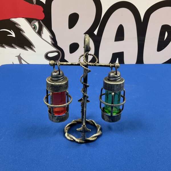 Vintage nautical salt and pepper shakers with anchor base.
