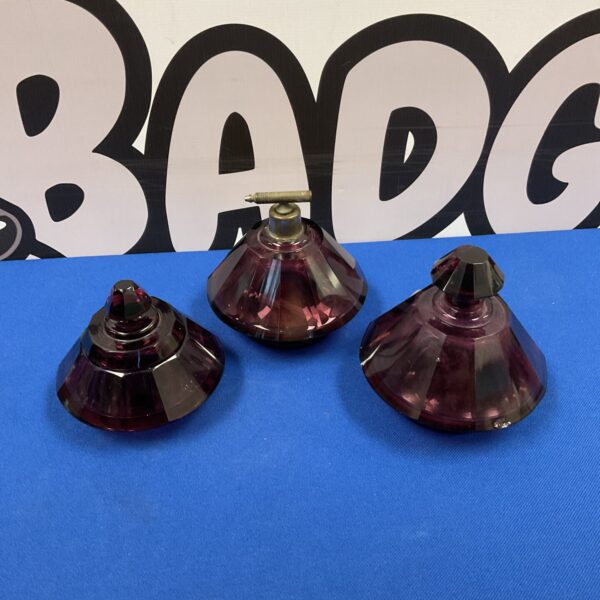 Vintage cranberry glass scent bottles with atomizer tops.