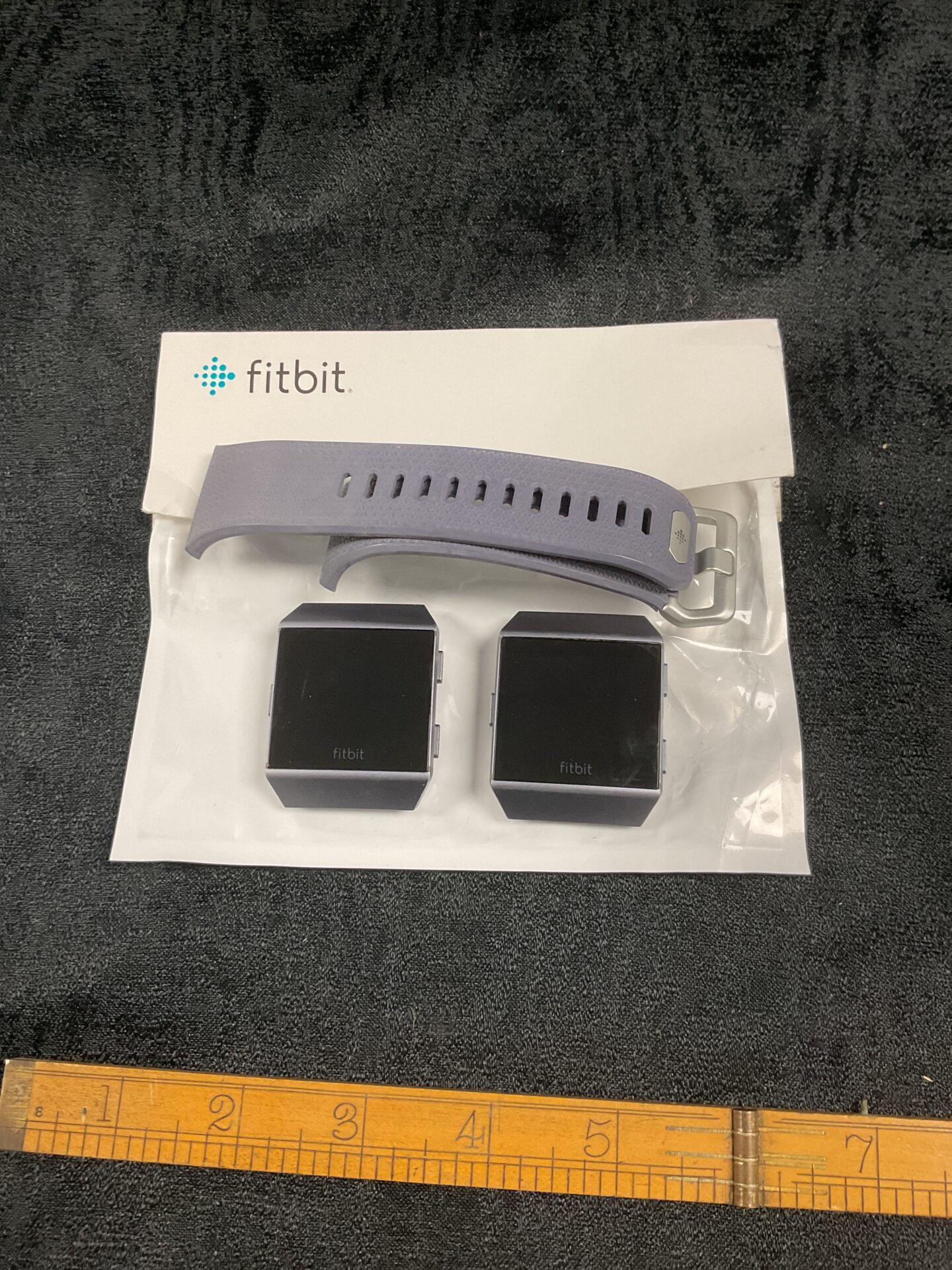 824 Two Fitbit watches one strap