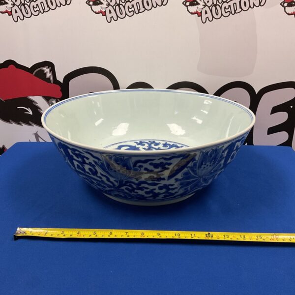 Large Chinese porcelain bowl with lotus pattern, side view.