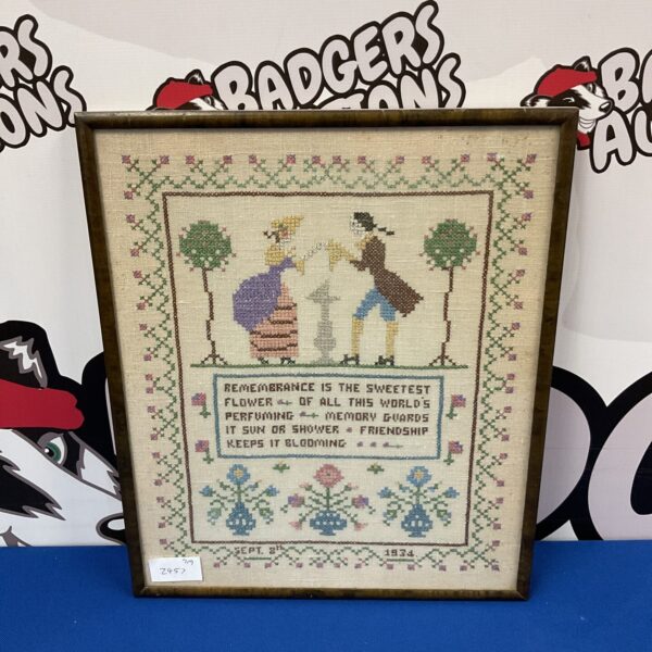 Vintage 1934 poem sampler embroidery with floral details.