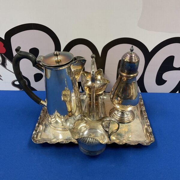 Antique silverplate coffee service set on a tray.