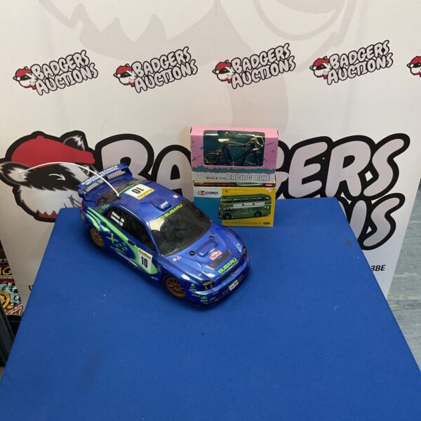 Subaru rally car diecast models and RC car collection.