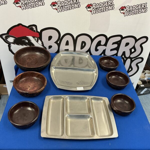 Stainless steel serving trays displayed for sale.