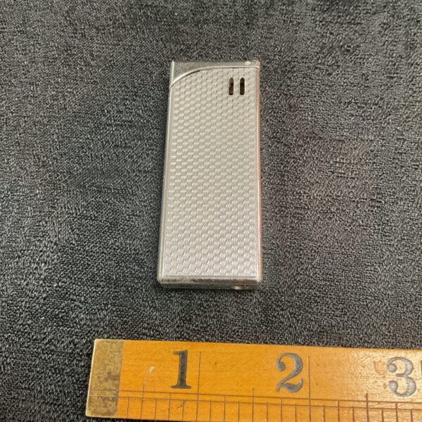 Vintage Ronson electronic lighter with brushed metal finish.