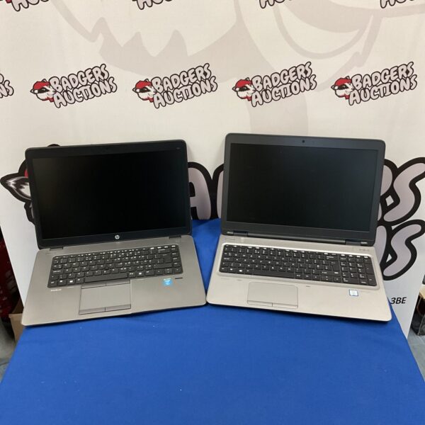 Two HP laptops, a ProBook and EliteBook, presented as-found.
