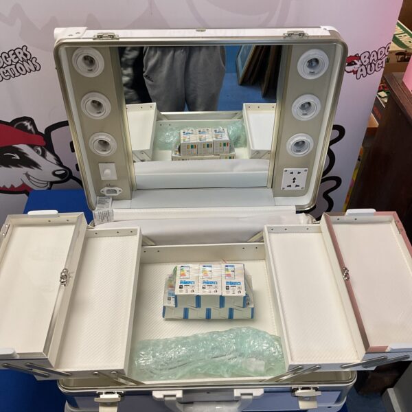 Silver portable makeup studio case with illuminated mirror.