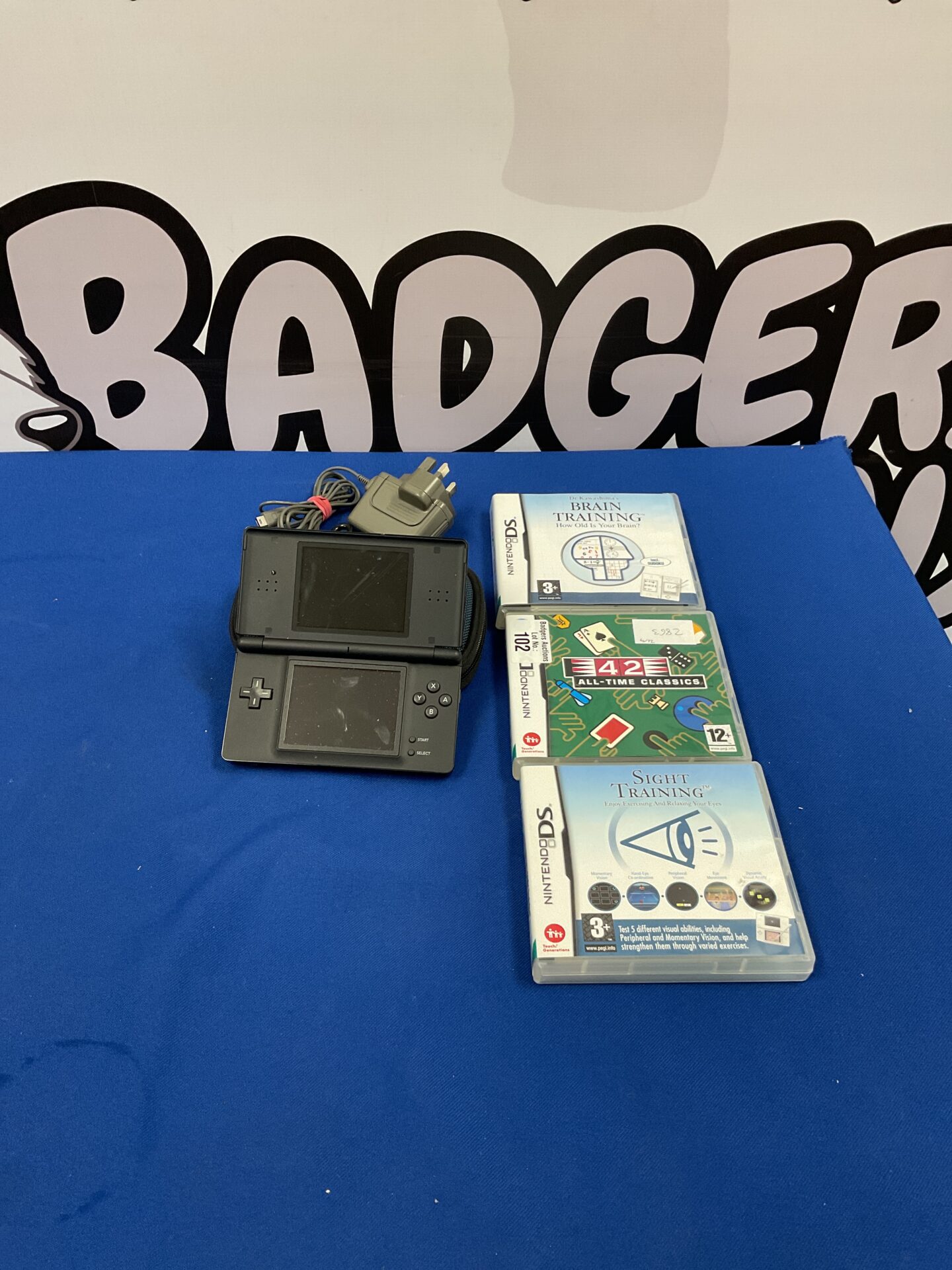 102 Nintendo DS console with three games and charger