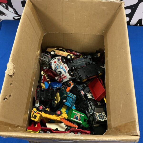 Overview of a diverse lot of vintage diecast toy cars.