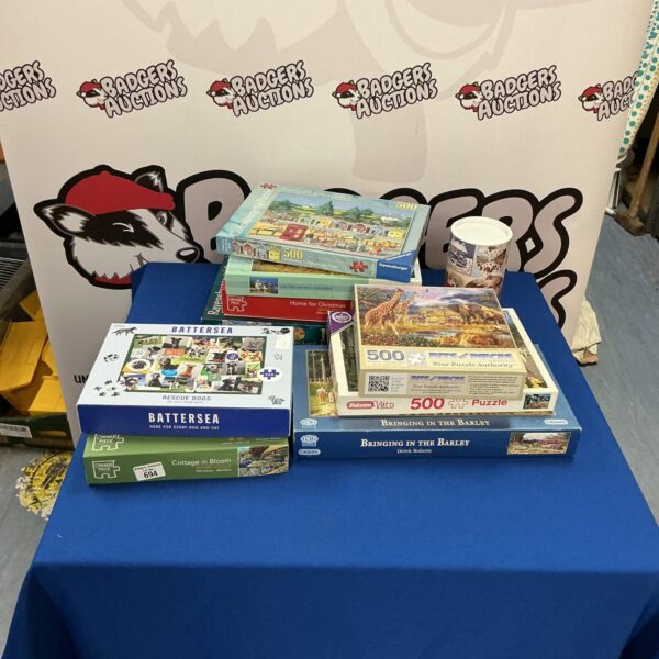 A lot of jigsaw puzzles including a Corner Piece puzzle.