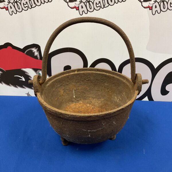 Antique Victorian cast iron cauldron with hanging loop and legs.