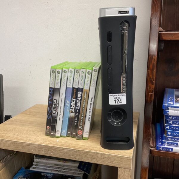 Xbox 360 console with games including Call of Duty and Halo.