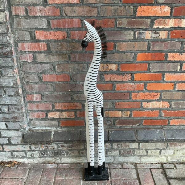 Large wooden zebra sculpture, a striking piece of folk art.