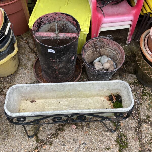 Vintage galvanised chicken feeder with trough, ideal for garden use.