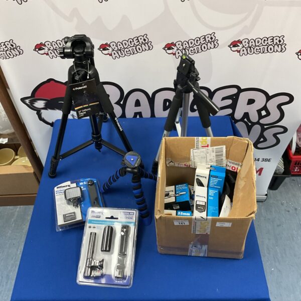 Camera tripod lot featuring Polaroid and Ultimax brands.