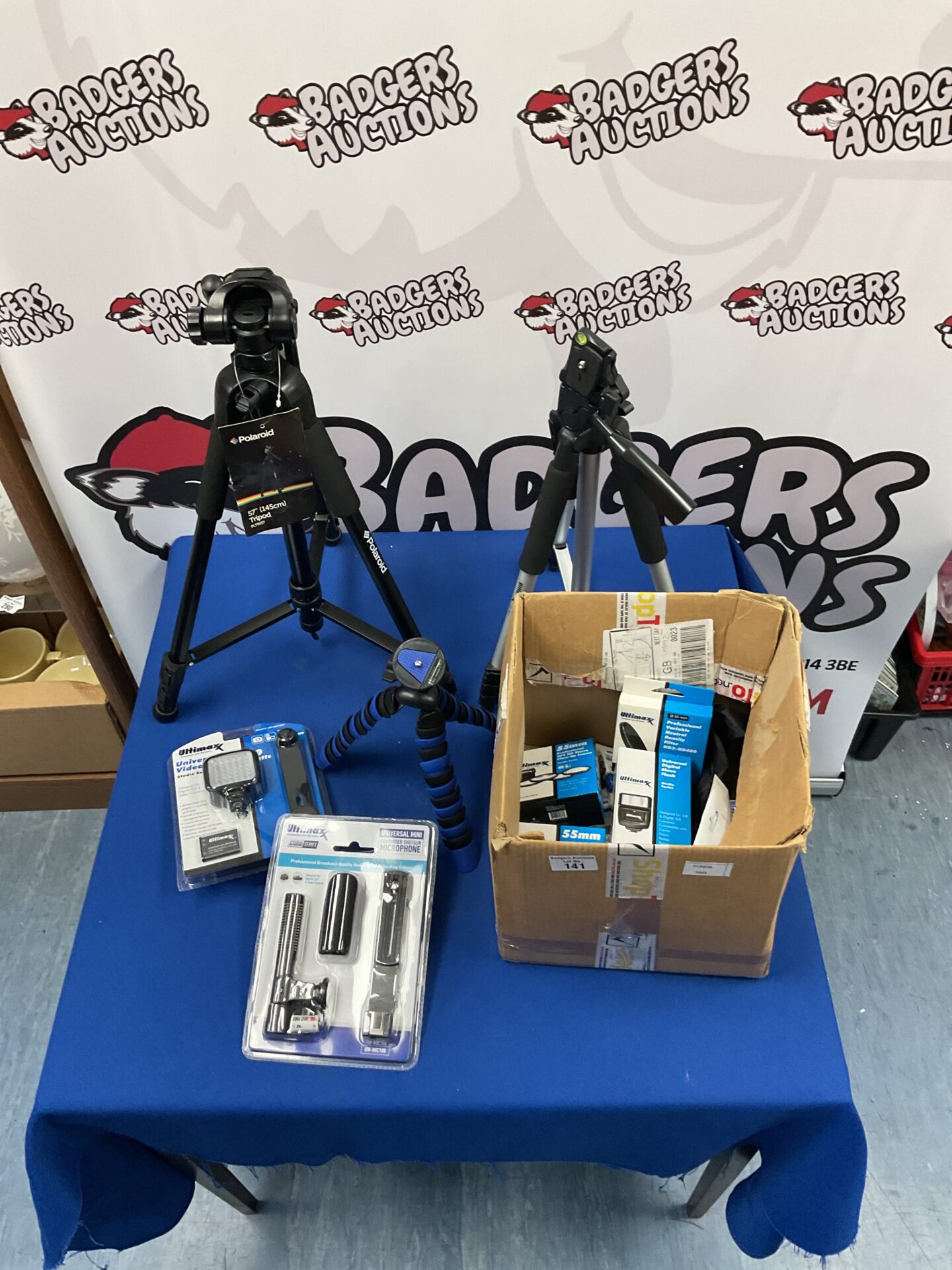 141 Polaroid 57” tripod, Ultimax tripod, and variety of Ultimax camera equipment