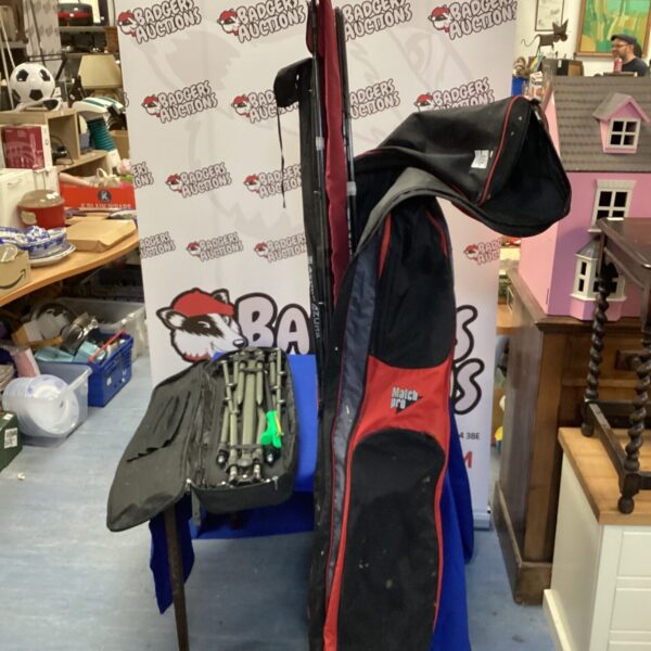 Fishing rod bundle with bag and rest, angling equipment.