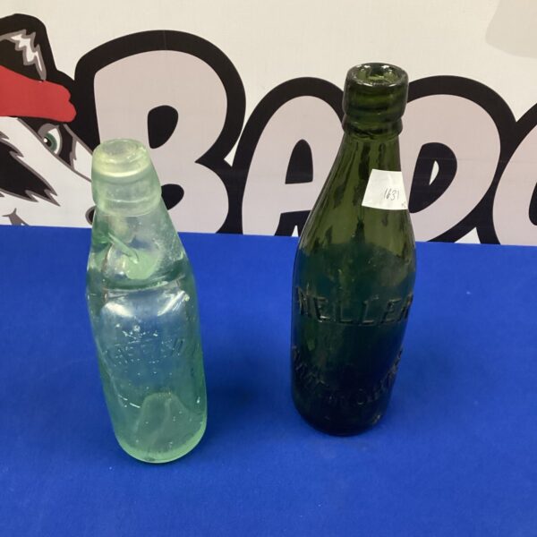 Vintage Amersham Brewery bottle, pale green glass, collectible item.