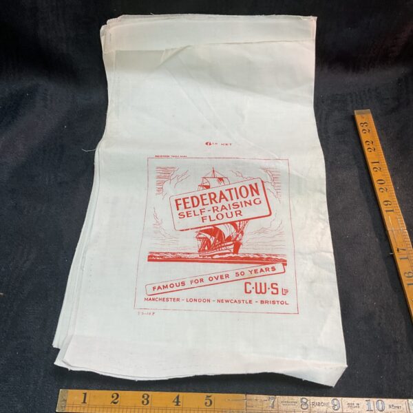 Stack of vintage wartime Federation flour bags.