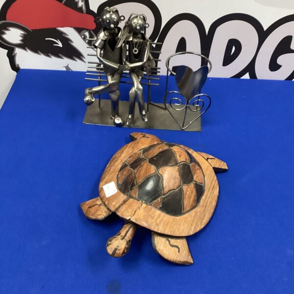 Detailed hand-carved wooden turtle sculpture for home decor.