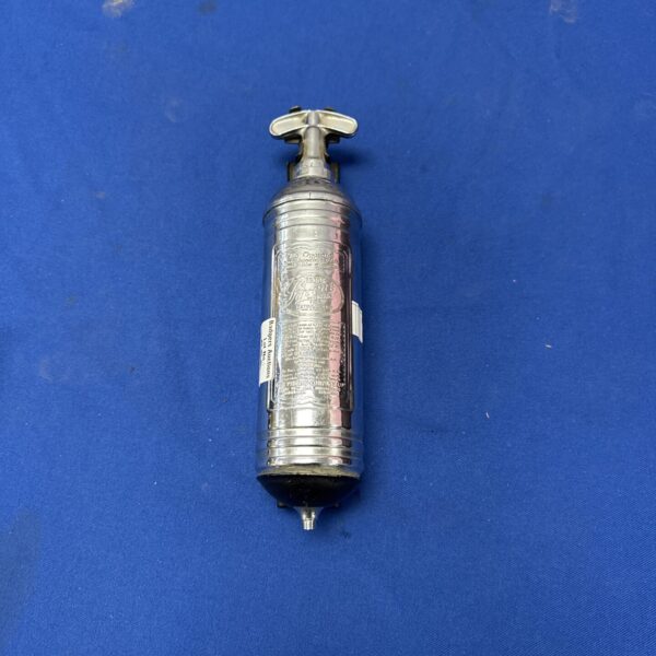 Vintage 1957 Pyrene fire extinguisher for classic cars.