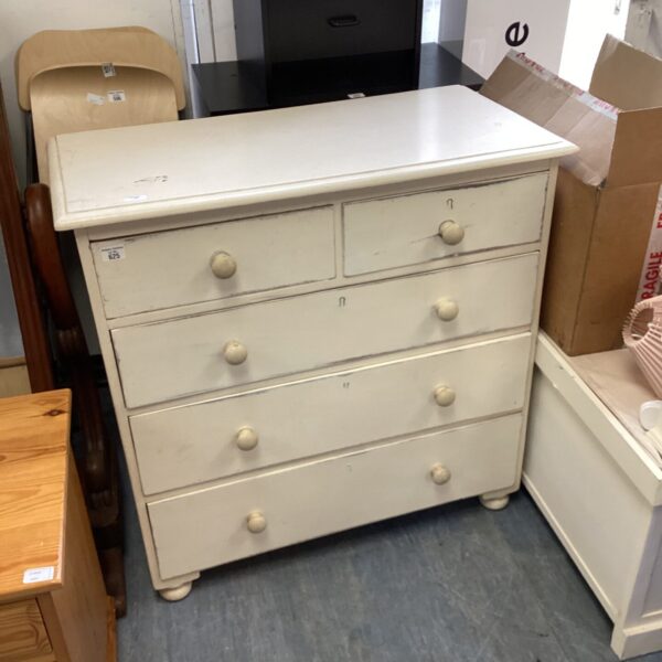 Vintage wooden chest of drawers with painted finish.