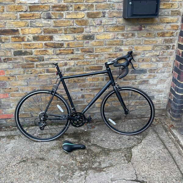 Side view of a used BrandX racing bike for sale.