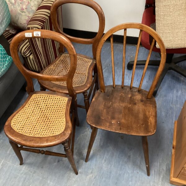 Vintage Ercol chair and woven seat chairs for retro home decor.