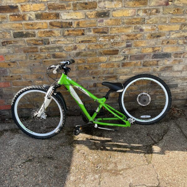 Green Carrera Blast mountain bike with front suspension.