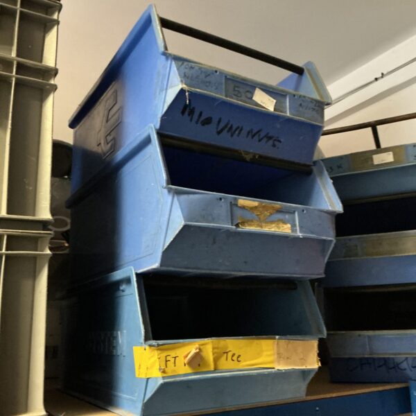 Three blue heavy-duty workshop storage trays stacked together.