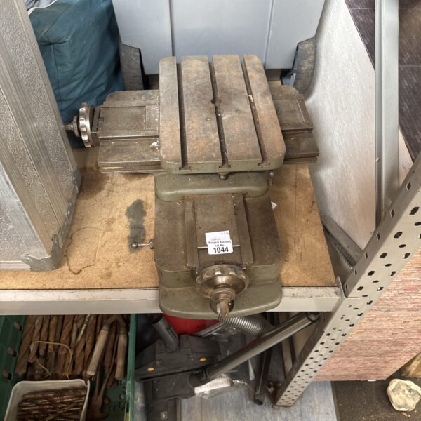Adjustable cast iron milling table for metalworking and machining.