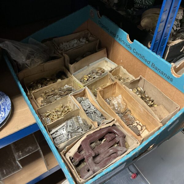 Tray of mixed engineering hardware and metal components.