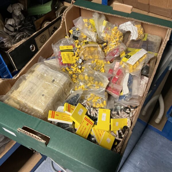 Tray of assorted insulated electrical connectors for wiring projects.