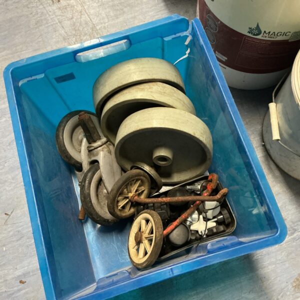 Assorted vintage and industrial wheels in a mixed lot.