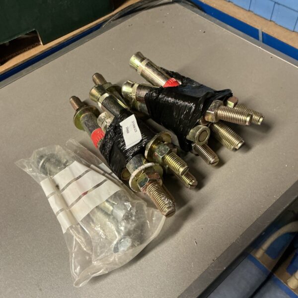 Bundle of used Fischer anchor bolts for construction and DIY projects.