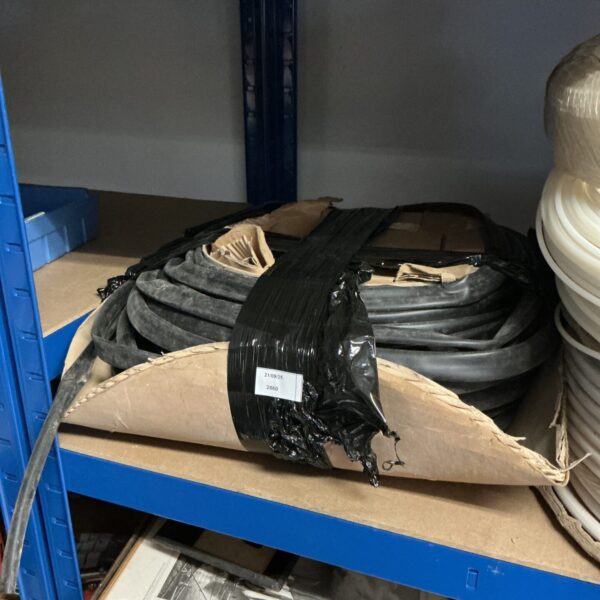 Roll of black rubber cable tubing for electrical wire protection.