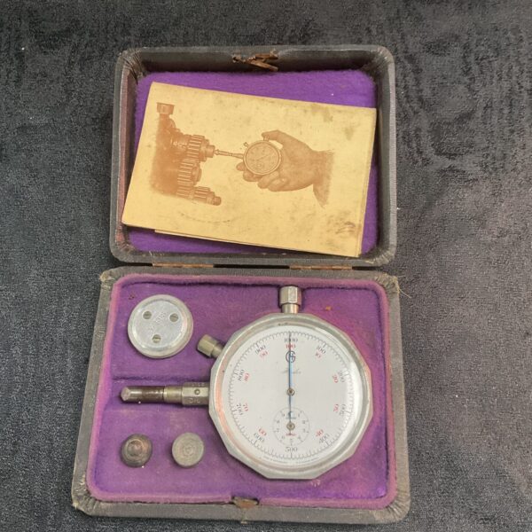 Vintage Hadley Swiss tachometer showing RPM dial and case.