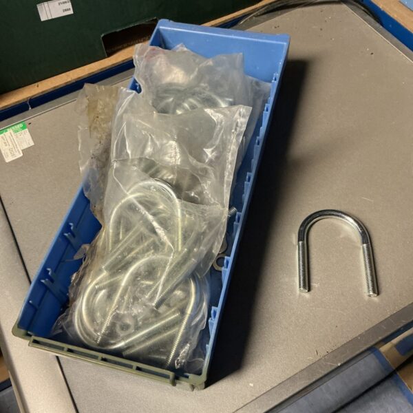 Tray of three sealed packs of U bolts for automotive or trailer use.