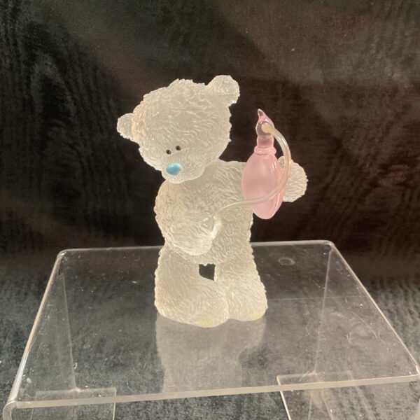Sweet Me to You bear ornament holding a perfume bottle.